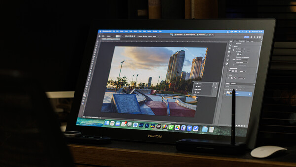 Screenshot of photo editing software displaying an architectural cityscape image with waterfront boats during post-processing.