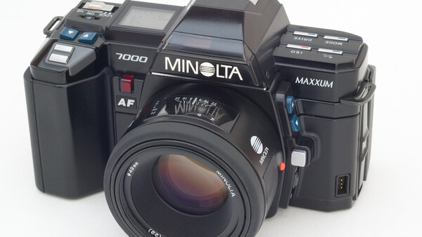 Three Minolta film cameras displayed side by side against a white background.