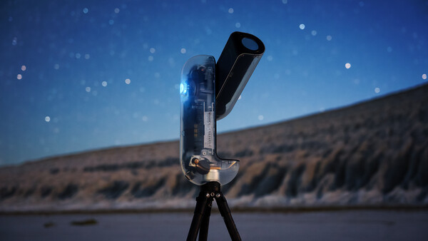 Illuminated telescope mounted on tripod against twilight sky with starfield bokeh effect and blurred landscape horizon.
