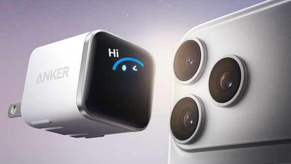 White compact power adapter and smartphone with triple rear camera module against starlit background.