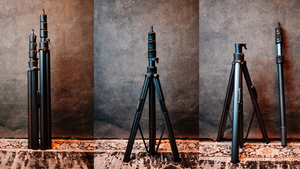 Four telescoping camera tripods displayed in different extended positions against a textured backdrop.
