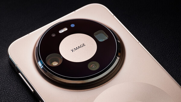 Circular camera module on white smartphone with multiple lenses arranged around center branding.