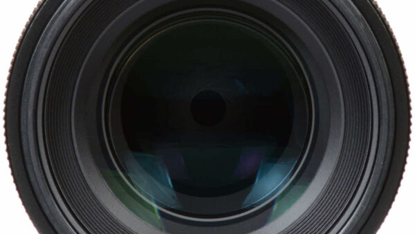 Front view of a telephoto lens with multi-element glass optics visible through the barrel