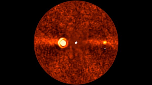 Thermal or infrared imaging illustration showing a circular red sphere with two bright hot spots and a central crosshair marker