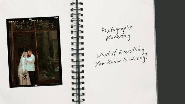 Open spiral notebook with handwritten text and vintage film photograph of a couple