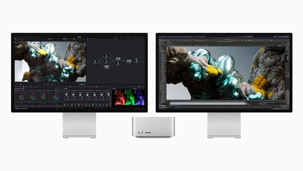 Three monitors displaying color grading software with VFX imagery of crystalline rock formations with glowing green and yellow light effects