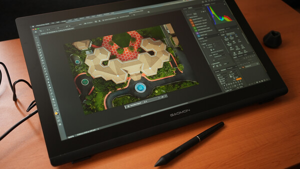 Wacom pen display showing aerial map design with red structures and interface panels
