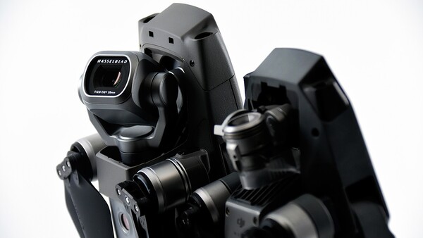 Professional camera rig with dual cinema lenses and integrated viewfinder mounted on rails