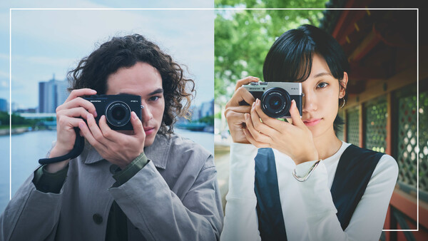Two photographers holding rangefinder cameras, side-by-side comparison portrait