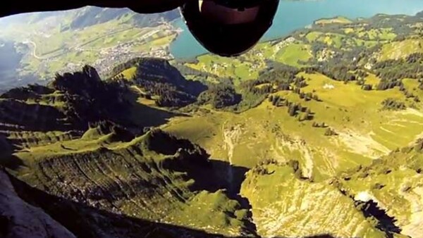 Wing-Suit Base Jumper Skims Feet Above The Ground