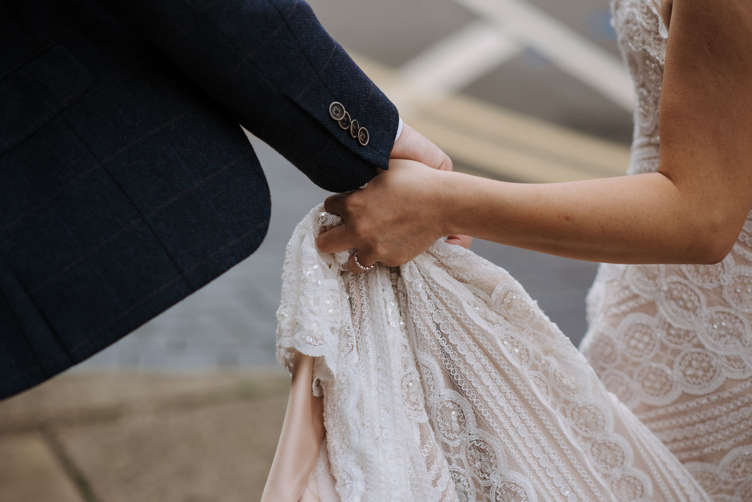 Bride and groom holding hands