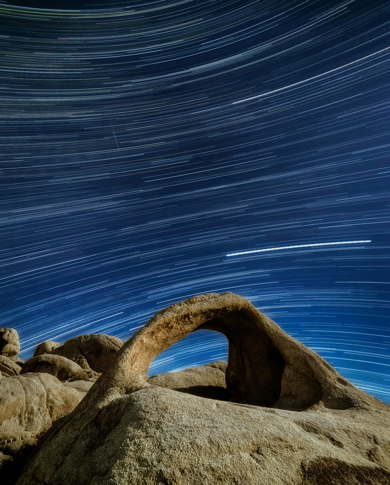 Star Trails over an arch in Mojave Desert, California.