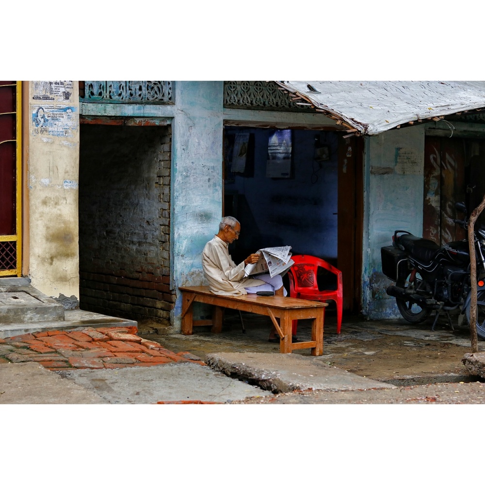 View A gentleman with newspaper by Ashish Gautam
