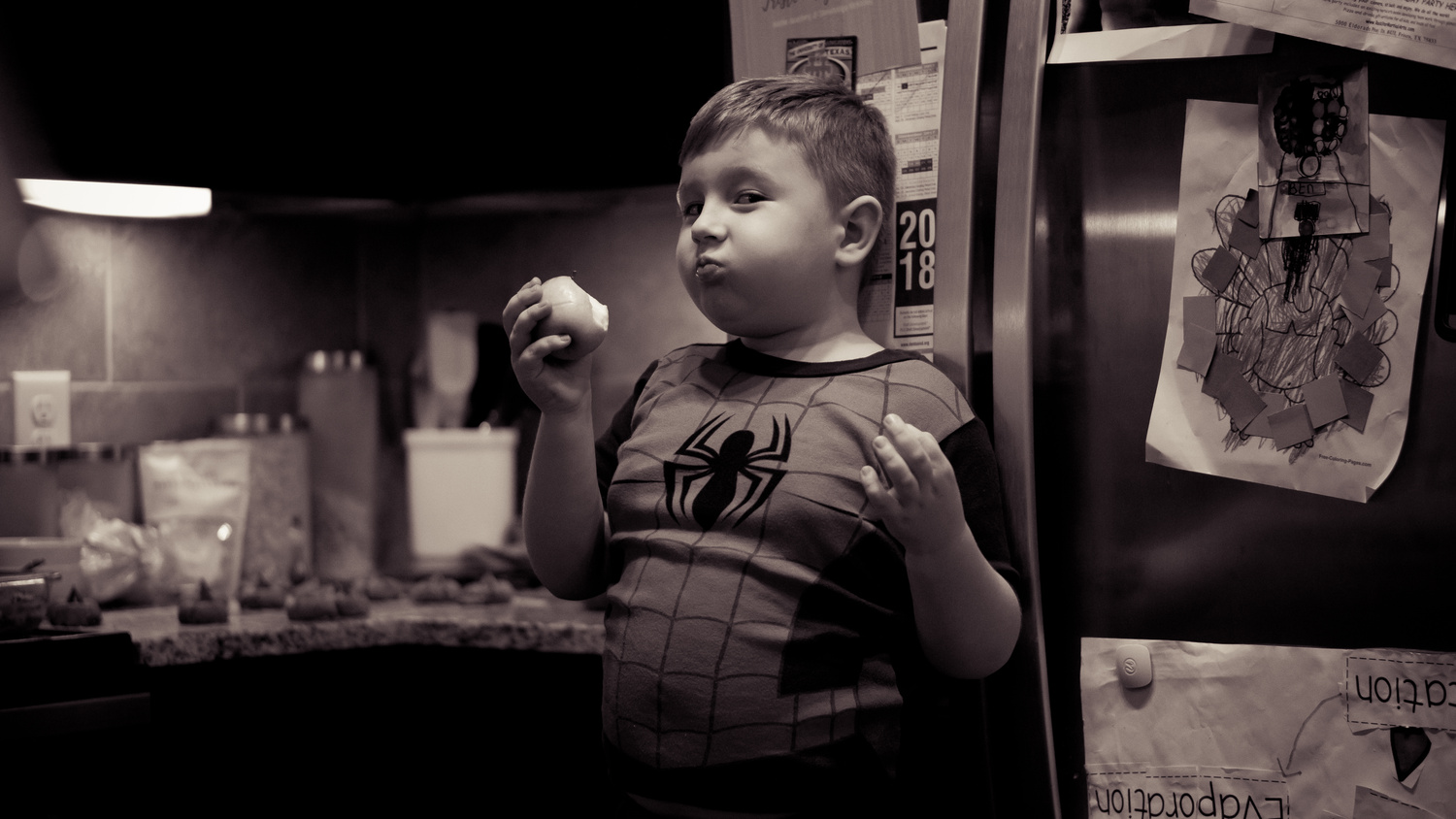 View Kid Eating Apple in PJ's by Jason Porter