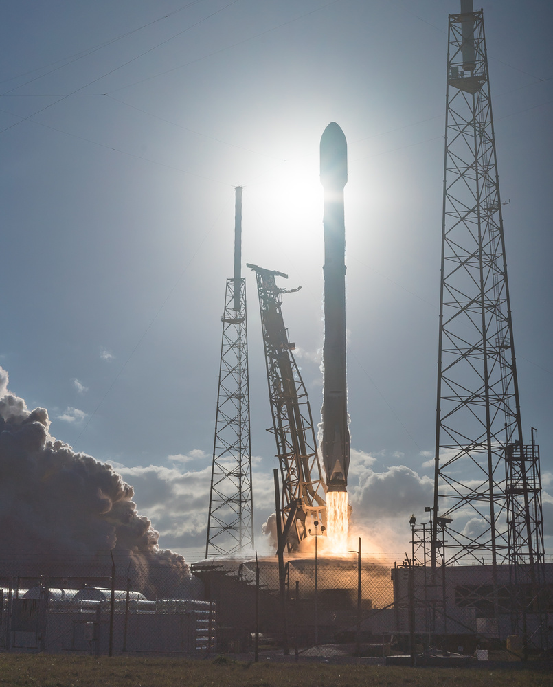 View Flame detail on a Silhouetted Falcon 9 by Ryan Chylinski