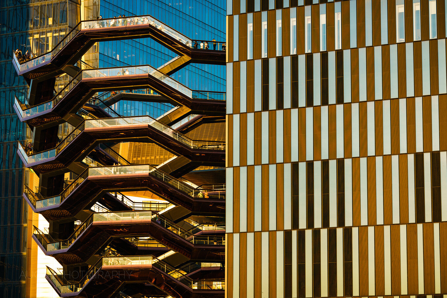 Split composition of sculptural staircase structure and geometric striped facade