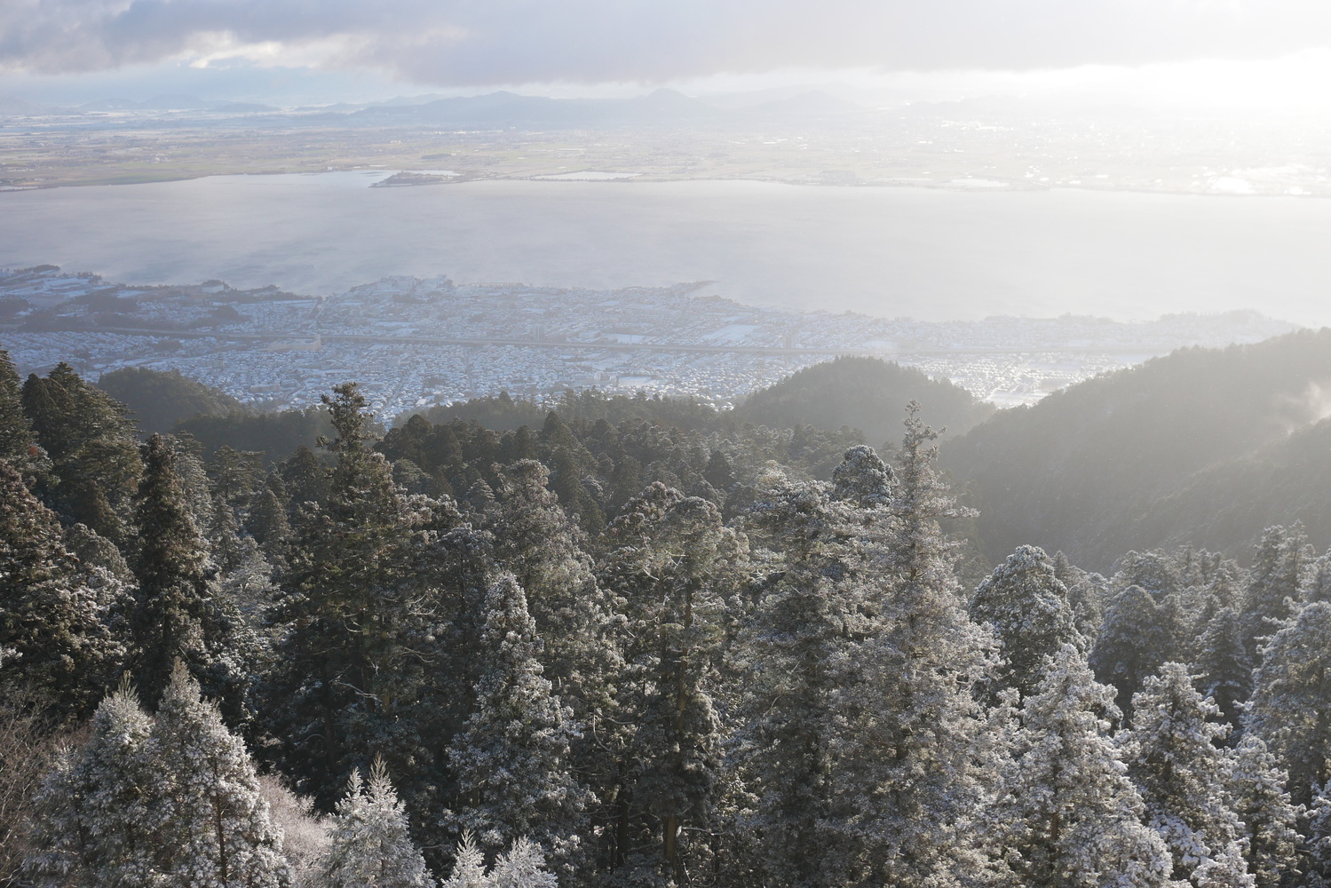 View Mountaintop view of a lake by Yingtong Quek
