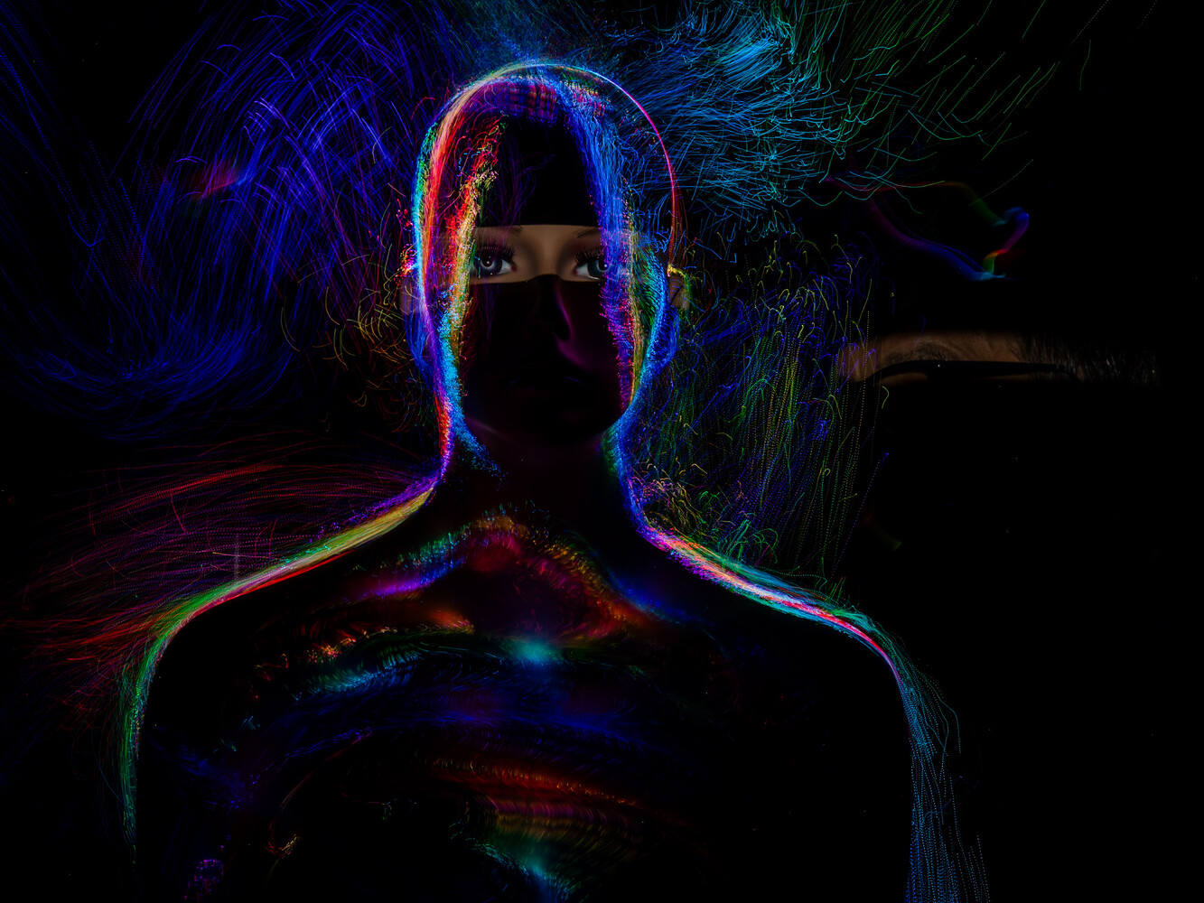 Silhouetted figure with neon light trails outlining head and shoulders against dark background