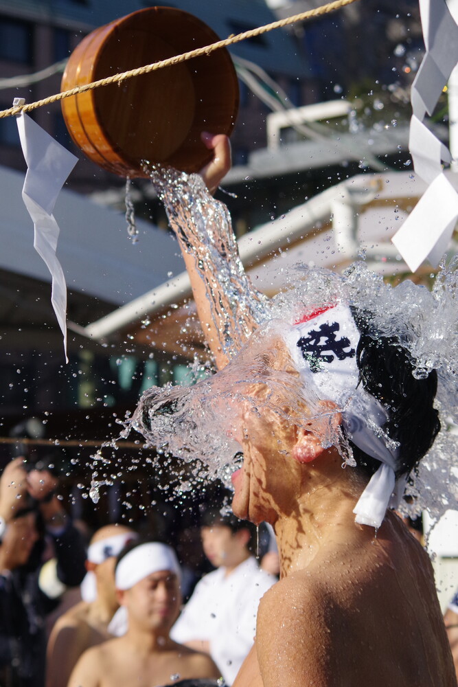 Ice bucket challenge water splashing over person's head