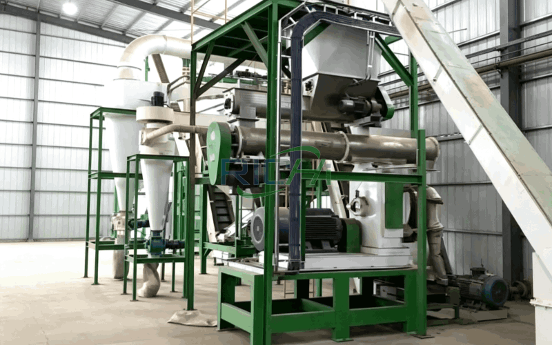 Industrial grain processing equipment with green steel framework in a warehouse setting