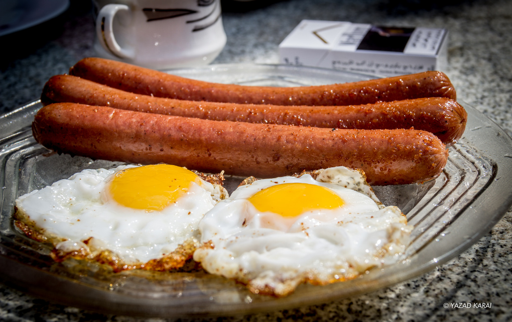 View Eggs & Sausages by Yazad Karai