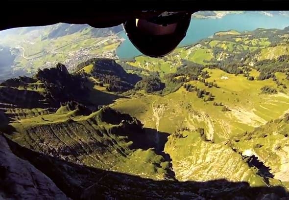Wing-Suit Base Jumper Skims Feet Above The Ground