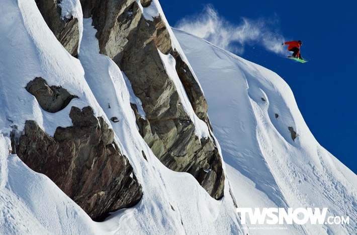 Snowboarders With Hundred Foot Vertical Drops