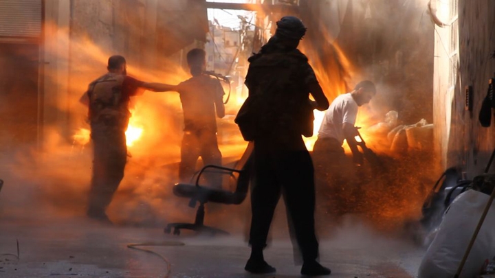 Photographer Catches Exact Moment Of A Tank Shell Hitting Syrian Rebels