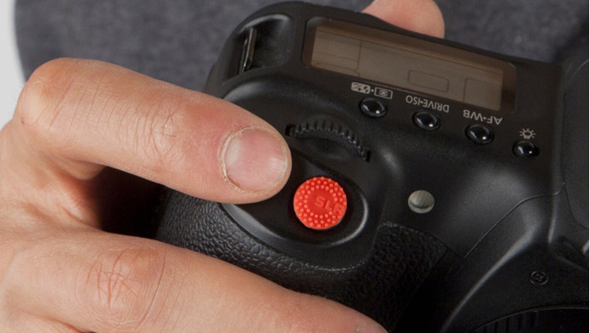 Enjoy A No-Slip Finger Grip With Shutter Button Sticker Called "ProDot" 