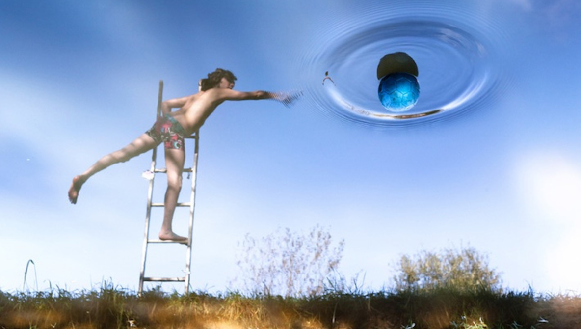 Father Photographs Children's Magical World Through Water Reflections
