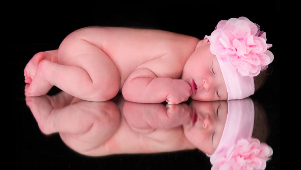 Watch How to Retouch Newborn Photos in Photoshop on YouTube.