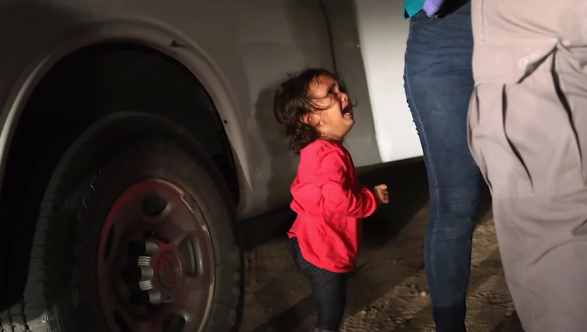 Watch Photographer explains photo of crying toddler at border on YouTube.