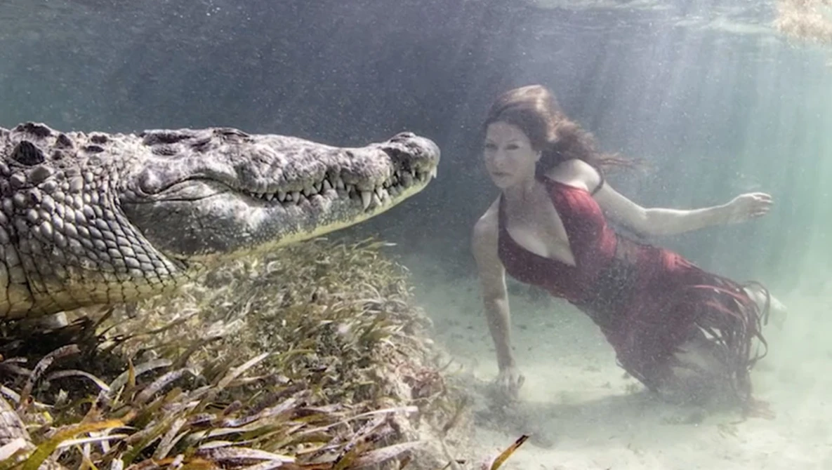 Watch Models Swim in Crocodile-Infested Waters for The Perfect Pic | New York Post on YouTube.