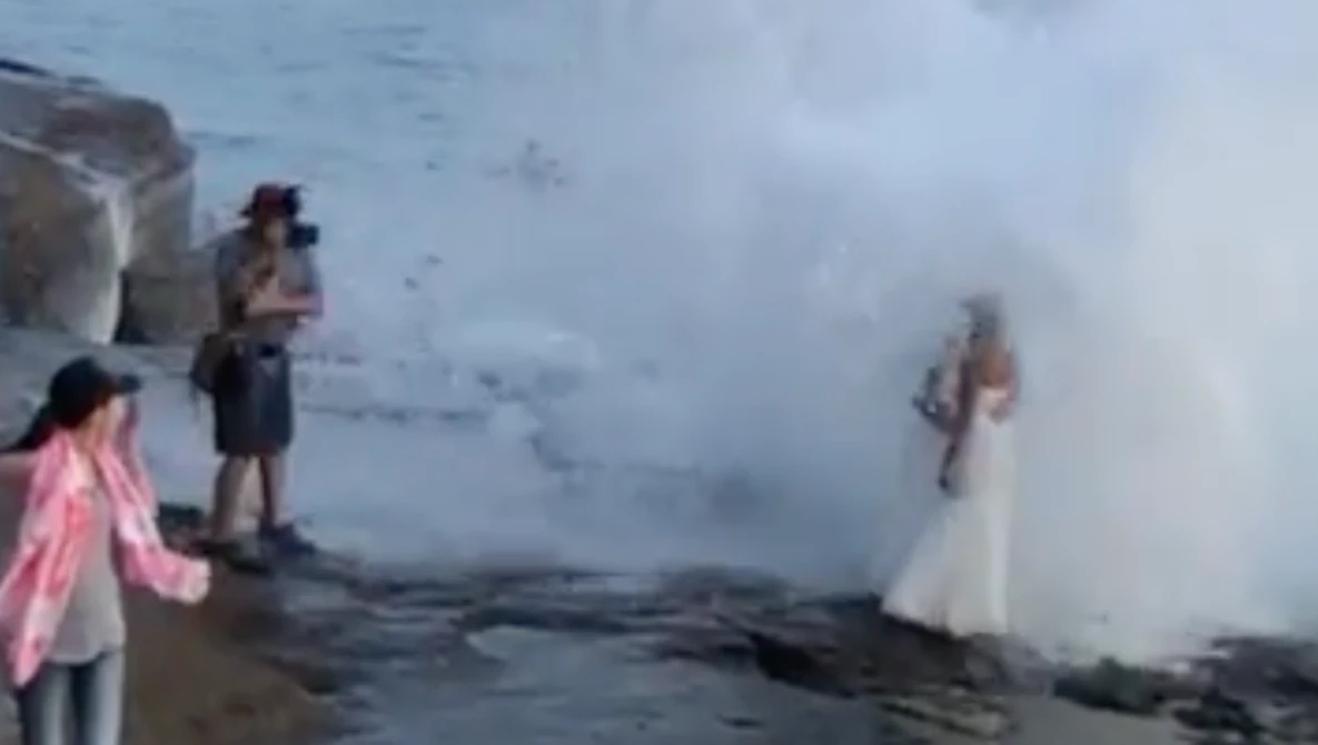 Watch Couple get drenched by huge wave during wedding photoshoot in the US on YouTube.