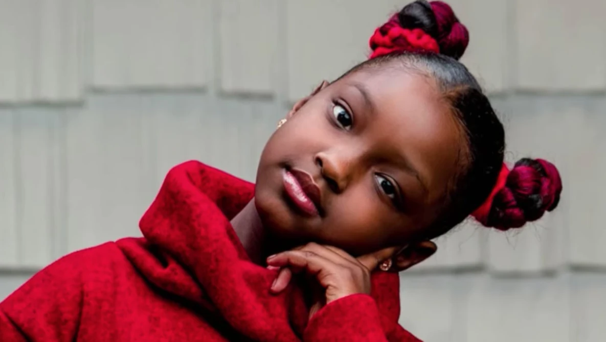 Watch 8-year-old girl denied school photos due to hair extensions gets empowering photoshoot on YouTube.