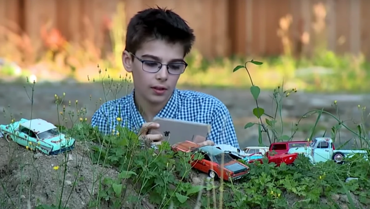 Watch 11-Year-Old with Autism Finds Outlet with Miniature Car Photography on YouTube.