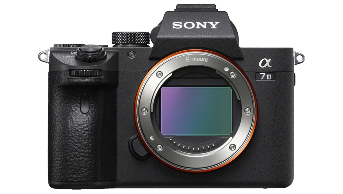 Sony α7 III mirrorless camera body shown front-on with lens mount exposed.