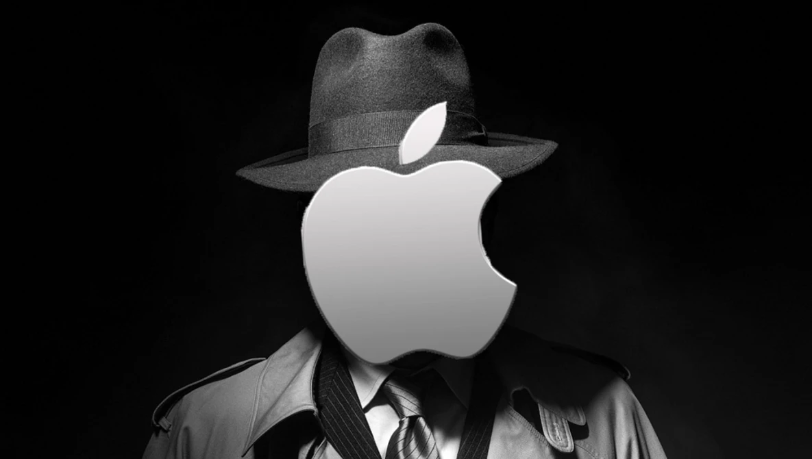 Figure wearing dark fedora and trench coat with Apple logo replacing head against black background.