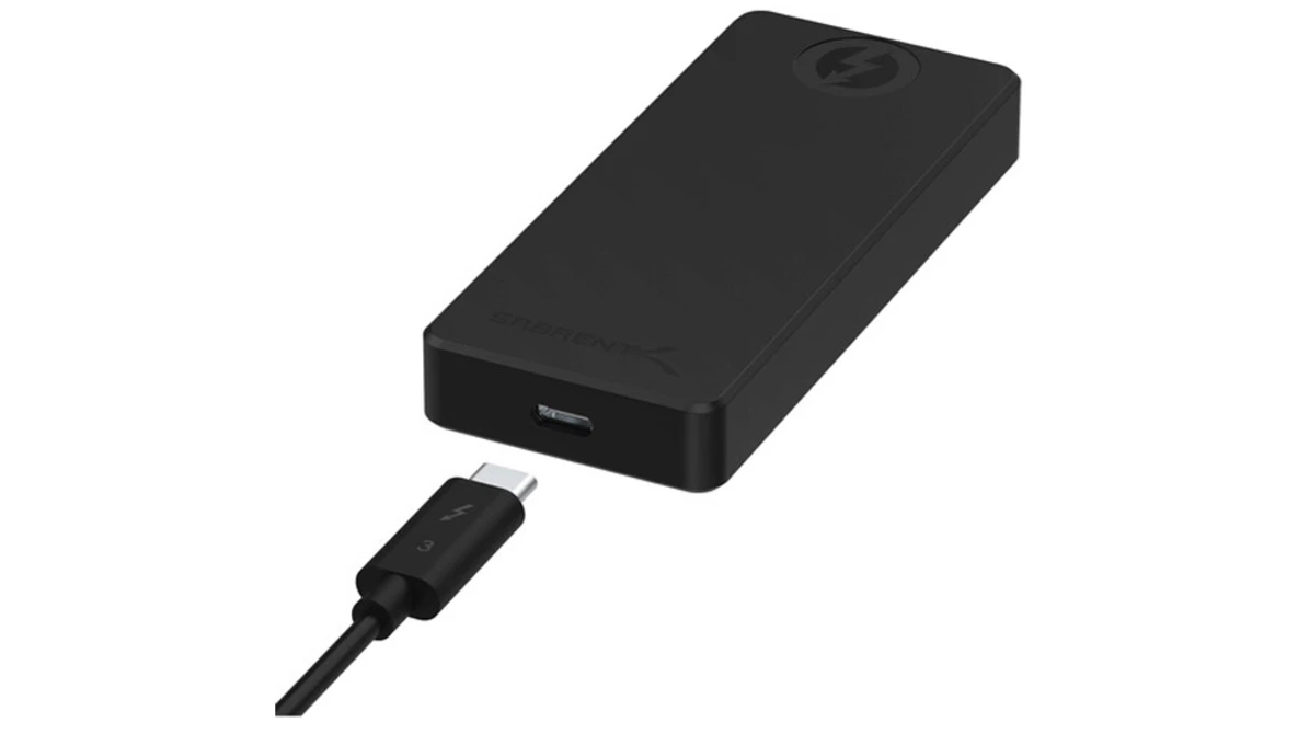 Black portable power bank with USB-C charging cable attached.