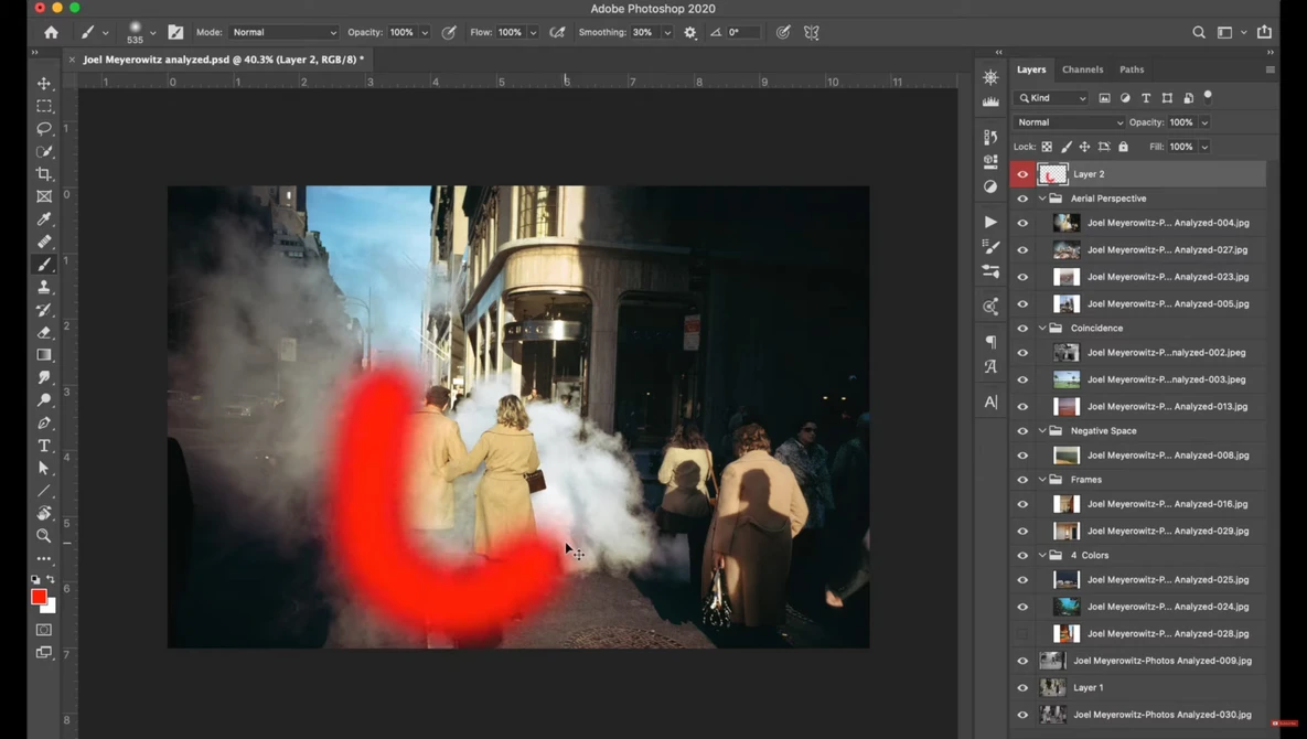 Screenshot of Adobe Photoshop showing a street scene photo with a red light blur overlay being edited.