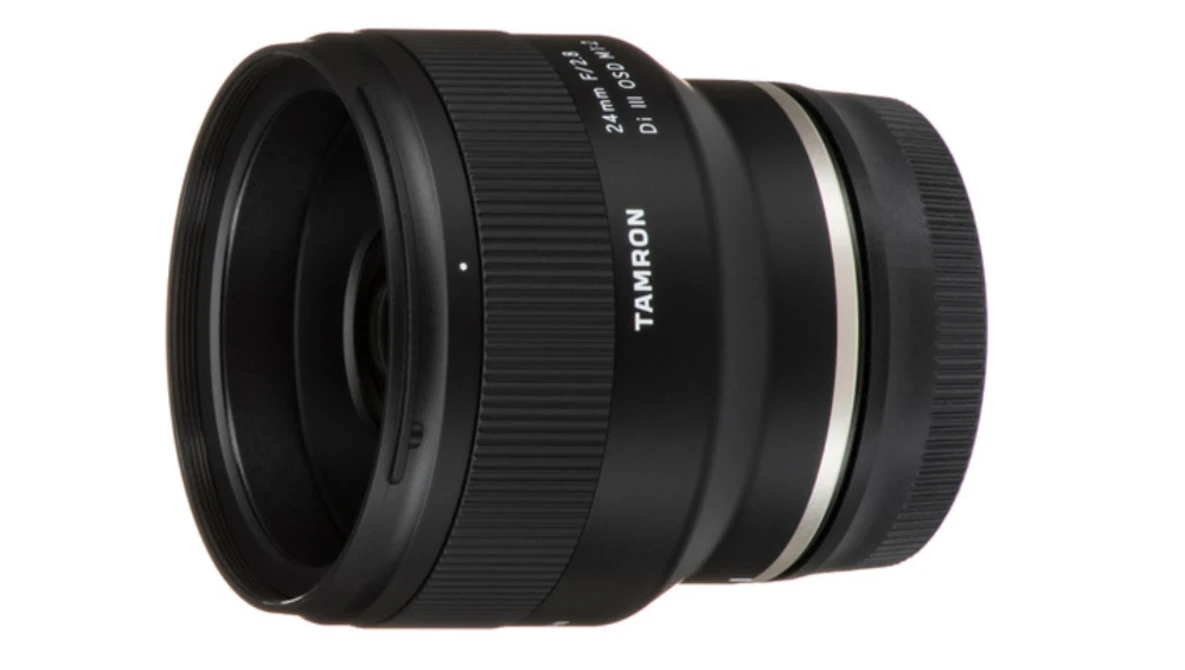 Tamron wide-angle prime lens with black barrel and white accent ring.