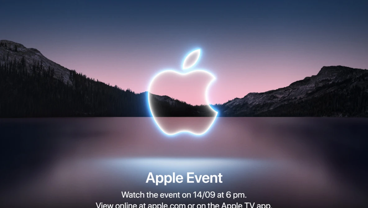 Neon glowing apple logo centered over a mountainous lake landscape at dusk.