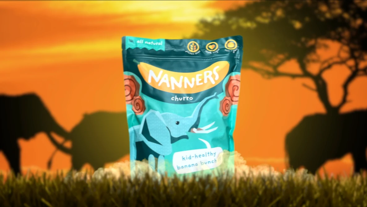 Product packaging for Nannery cherto snack displayed against an African savanna sunset backdrop with silhouetted acacia trees.