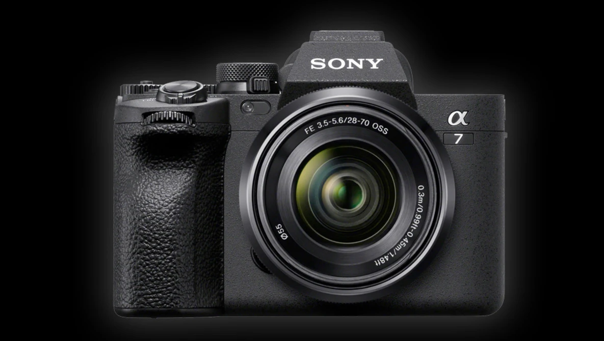 Sony Alpha 7 mirrorless camera with attached zoom lens against dark background.