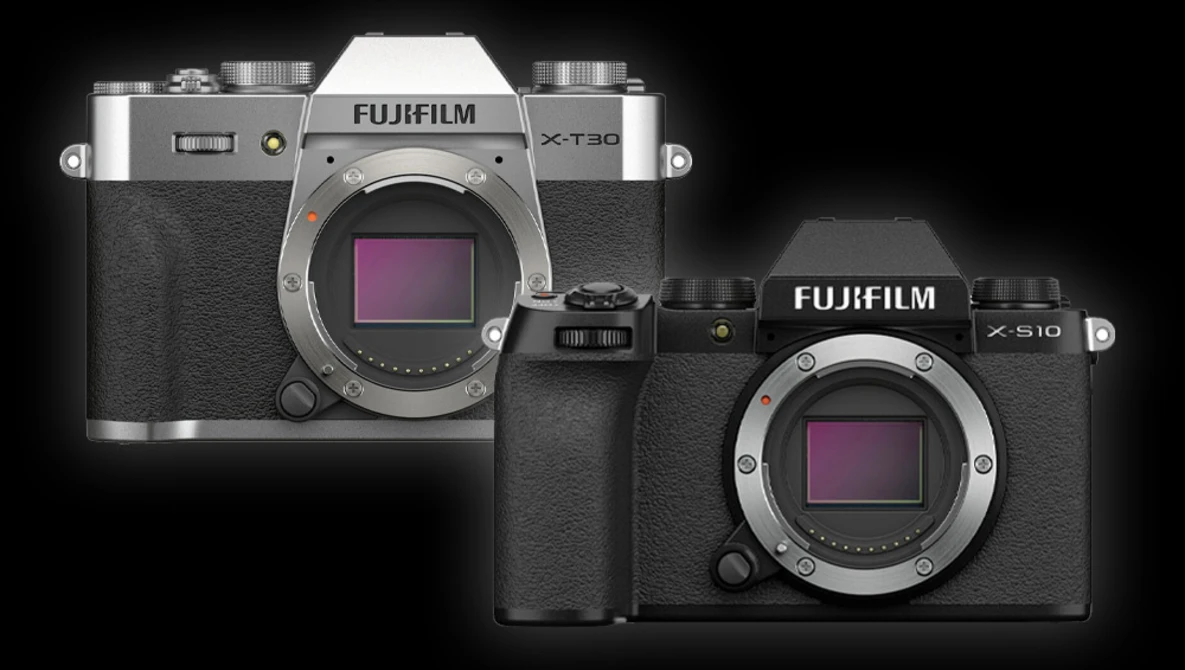 Fujifilm X-T30 and X-S10 mirrorless cameras displayed side by side against a black background.