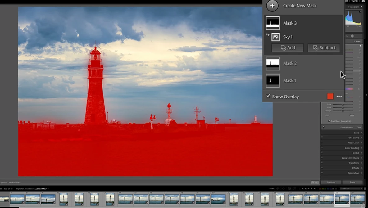 Screenshot of photo editing software showing a lighthouse image with red mask overlay applied.