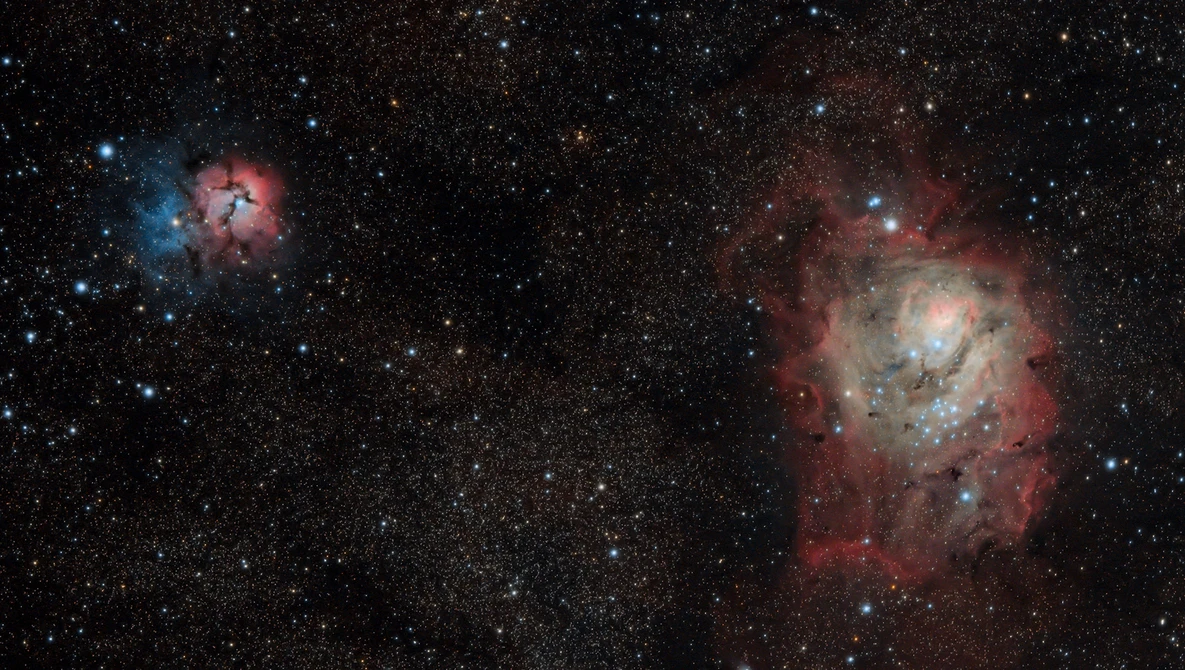 Deep space photograph showing two nebulae with blue and red emission clouds surrounded by stars.