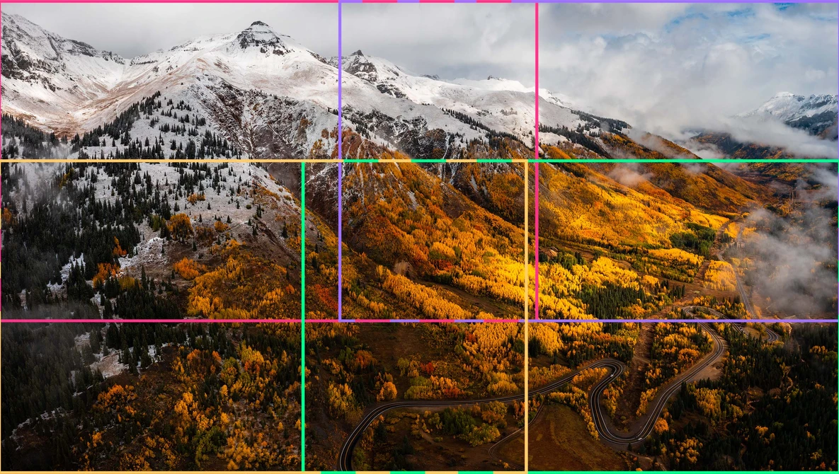 Mountain landscape with snow-capped peaks and golden autumn forest in valley below, divided by colored grid lines.