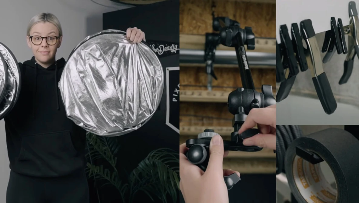 Photographer holding circular silver reflector with various lighting modifiers displayed on right side.