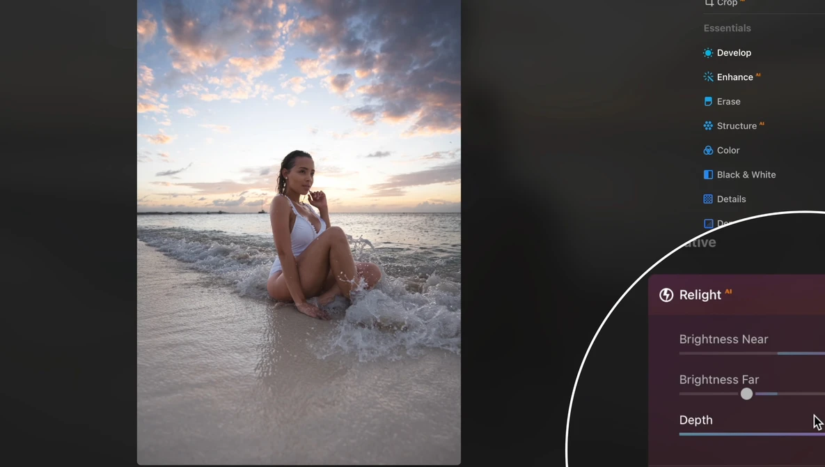 Woman seated in shallow ocean water at sunset, wearing white swimwear with dramatic cloudy sky above.
